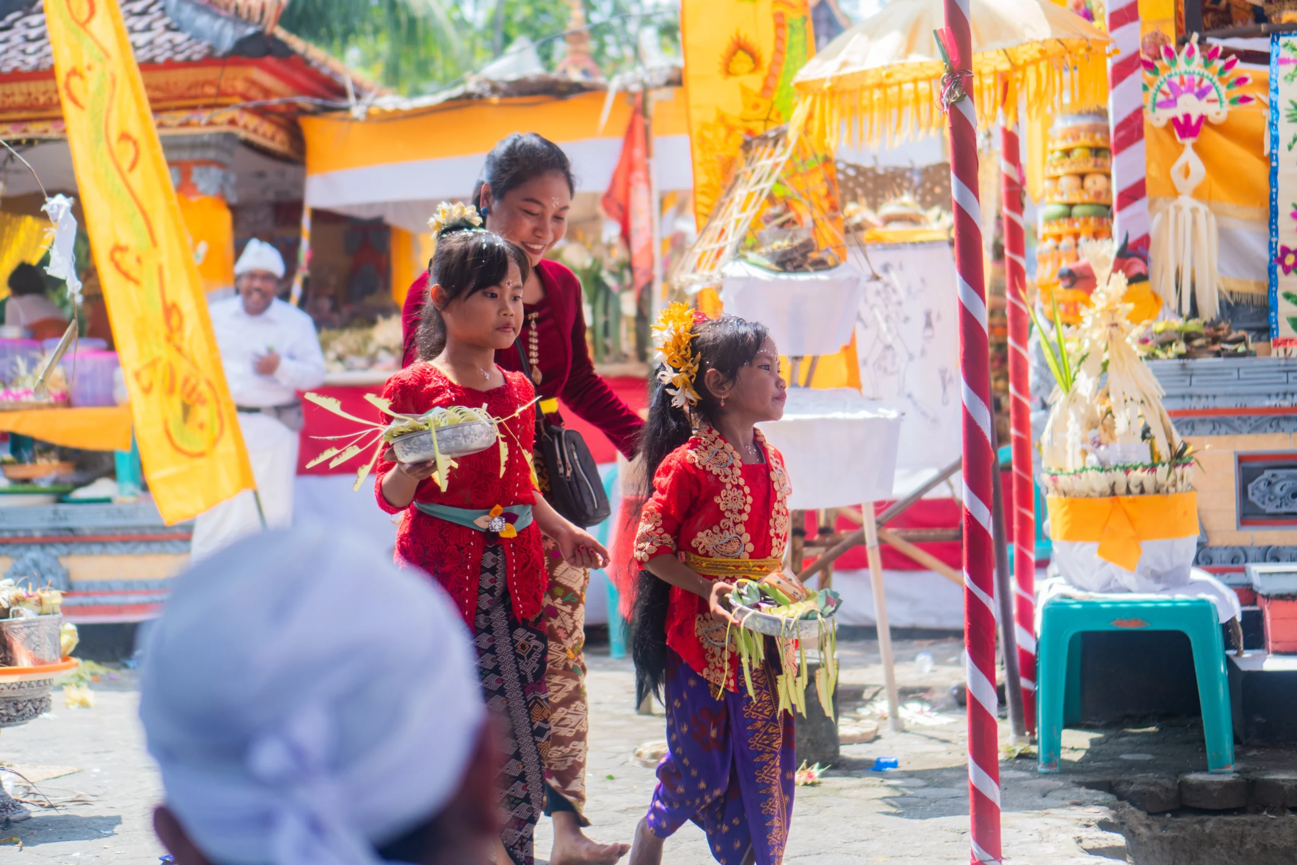 Balinese Families Celebrating Saraswati Day at a Temple