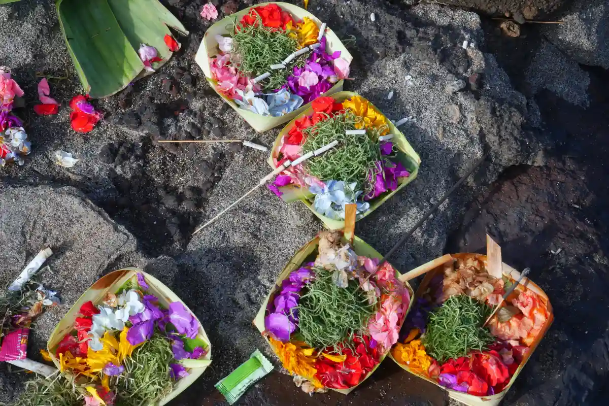 Traditional Balinese Hindu offering with flowers and ceremonial elements