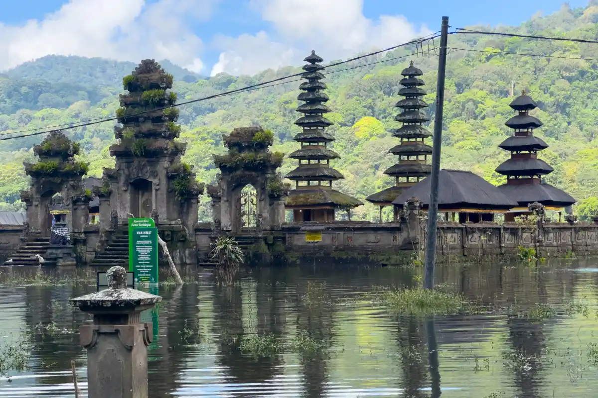 Pura Ulun Danu Tamblingan reflected in the calm waters of Lake Tamblingan