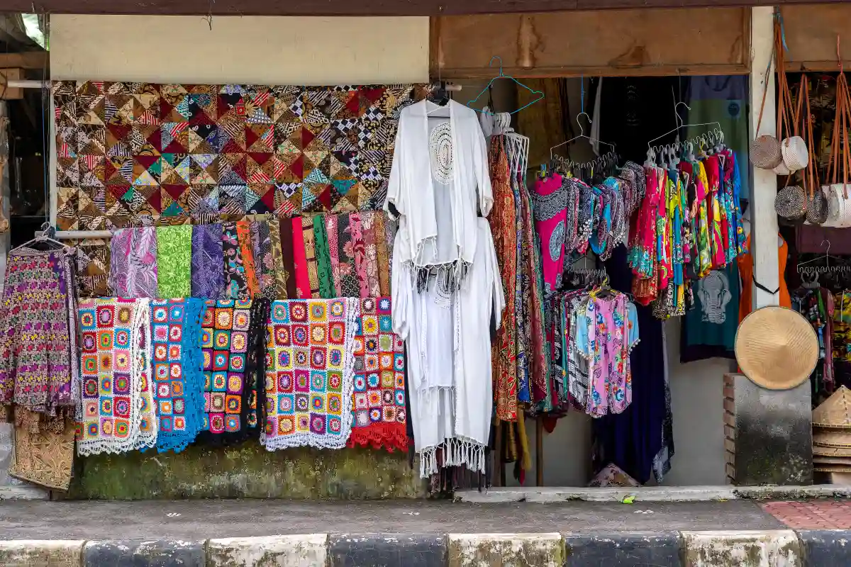 Colorful fabrics and clothing displayed at a local market in Ubud Bali