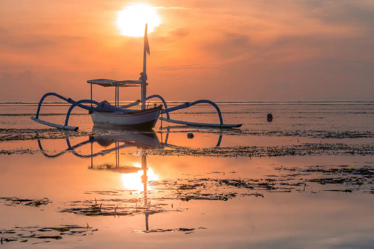 traditional boat on the beach at Sunset